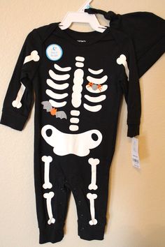 Carter's One-Piece Halloween  Skeleton Jumpsuit with Hat Infant Boy Size 6 Months Fits 12.5-17 lbs., 24-27" height One-piece black knit jumpsuit with a glow-in-the-dark skeleton printed on the front. Also comes with a cute black knit cap hat. Brand New with Tags! MSRP: $22.00 I ship quickly, the same day or next day. My home is smoke free. Skeleton Jumpsuit, Dark Skeleton, Baby Bats, Infant Boy, Skeleton Print, Knit Jumpsuit, Halloween Skeleton, Knit Cap, Halloween Skeletons