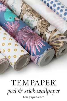 several rolls of wrapping paper with the words,'tempaper peel & stick wallpaper '