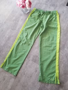 Vintage Nike Track Pants Green Lime Polyester Sweatpants Black Ankle Swoosh Y2K Skate / Streetwear Great Condition: 9/10 Youth Size: Large My Hands in Pockets = It has Pockets No Hands in Pockets = Does Not Have Pockets Drawstring Will be Visible in Forward Pic, if not Visible it Does Not Have a Drawstring About me: I am 5' 3" for reference I generally wear a Small I Model XS to 2XL sweatpants, I find that you can often size up or down with 95% of sweatpants and they fit the same Nike Vert, Nike Vintage Track Pants, Vintage Nike Track Pants, Hands In Pockets, No Hands, Nike Track Pants, Skate Streetwear, Sweatpants Black, Skater Streetwear