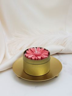 Introducing our Fuchsia Pink Floral Candle: a blend of serene aromatherapy and exquisite craftsmanship. Handmade with premium soy wax, it fills your space with delicate floral fragrance. Packaged in a luxurious gold tin, it's the perfect gift for her. Illuminate your surroundings with tranquility and beauty. Scents Romantic Florals - Comforting and romantic scent - includes hints of rose, orange & jasmine Calm & Relax - Designed to re-charge & reduce feelings of stress - includes lavender, berga Tin Flowers, Floral Candle, Gold Candles, Citrus Scent, Pink Daisy, Flower Candle, Tin Candles, Aromatherapy Candles, Candle Shop