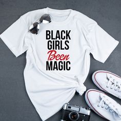 "Welcome to Creativeambitionz! If you are looking for soft, comfy, first-rate affordable T-Shirts, you're in the right place! This \"Black Girls been magic\" T-shirt is an excellent gift Idea for the women and young ladies in your life! This T-Shirt will make a fantastic birthday, Mother's Day, or just because gift! SPECIFICATIONS Choose Between: *Choose A V-Neck or Crew neck T-Shirt -All of our Tshirts are made with Premium Vinyl and A commercial heat press -100 % Cotton -Soft Style -Modern Cla Trendy Black T-shirt With Name Print, Trendy Black T-shirt For Birthday, Just Because Gifts, Black Barbie, Girls Tshirts, Neck T Shirt, African American, Mother's Day Gifts, Mothers Day