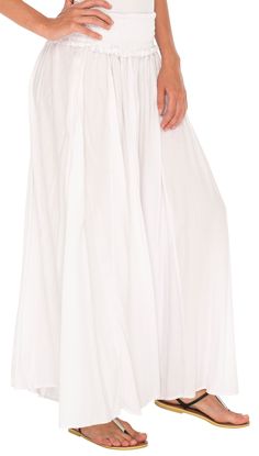 Get your comfort on with these wide leg palazzo pants. Flowy and free help bring out your bohemian side. Perfect for summer days because the material is lightweight and breathable. No heavy fabric here! Elastic waist and side pockets enhance the flowy pants. Easily dress up these pants with heels and a fun top or lounge around the house. Whatever you choose these pants will provide you comfort all day long. Wide and flowy pant legs Side pockets and elastic waistband Soft and lightweight material Flowy Wide Leg Maxi Skirt For Summer, Wide Leg Maxi Skirt With Elastic Waistband For Beach, White Bohemian Wide Leg Pants With Elastic Waistband, Bohemian White Wide Leg Pants With Elastic Waistband, Flowy Maxi Bottoms With Elastic Waistband, Bohemian Full-length Wide Leg Pants, Flowy Cotton Maxi Bottoms, Spring Festival Wide Leg Pants, Flowy Wide Leg Harem Pants For Beach