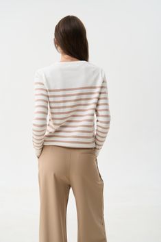 This trendy striped sweater in beige and white is a must-have for the new season. The neutral beige color can be harmoniously combined with various shades of blue denim, caramel, brown, and gray. The simple design makes it easy to pair the sweater with jeans, pants, and skirts of different styles. Our favorite choice is a cozy look with a blue denim palazzo and cowboy boots. Casual Taupe Sweater For Spring, Beige Cotton Sweater For Workwear, Striped Fine Knit Sweater For Spring, Chic Beige Cotton Sweater, Casual Striped Sweater For Work, White Sweater With Contrast Stripes For Spring, White Striped Sweater For Spring, Chic White Sweater With Contrast Stripes, White Cotton Sweater With Horizontal Stripes