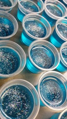 blue and silver glitter in small plastic bowls