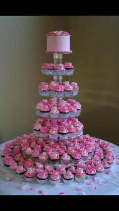 cupcakes are arranged in the shape of a tower