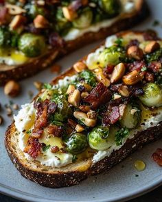 two pieces of bread topped with brussel sprouts and nuts