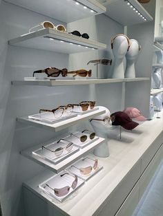 the display case is filled with many different types of eyeglasses and other items