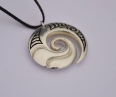 Hand crafted New Zealand Maori koru in Solid .925 sterling silver. Finished by hand to a high polish with traditional Maori engraved detail and hung on a black adjustable cord. The Maori koru design is a treasured symbol in New Zealand that represents nature . It brings personal growth and renewal of the spirit (Wairua) with inspiration for new ideas & adventures. We have added a sculptural wave design to bring energy & vitality and connections with the ocean. Unique New Zealand designs Artisan Engraved Adjustable Jewelry, Adjustable Carved Sterling Silver Jewelry, Artisan Adjustable Jewelry With Polished Finish, Artisan Pendant Jewelry With Adjustable Cord, Spiral-shaped Engraved Sterling Silver Jewelry, Unique Silver Necklace With Adjustable Cord, Engraved Sterling Silver Spiral Jewelry, Silver Jewelry With Adjustable Cord As Gift, Silver Jewelry With Adjustable Cord For Gift