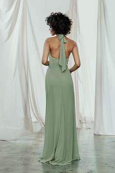 the back of a woman in a green dress