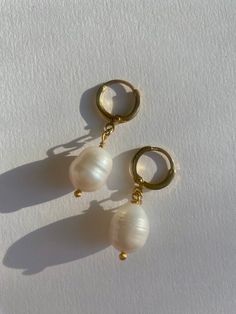 Freshwater pearl earrings, 10mm genuine high lustre pearls, on a delicate gold plated huggie hoop earring. Sold in pairs Also available in a 925 sterling silver hoop, available on request Pearl Charm Huggie Earrings, Pearl Drop Huggie Earrings As Gift, White Huggie Earrings With Pearl Drop, White Small Hoop Huggie Earrings With Pearl Drop, White Round Huggie Earrings With Pearl Drop, Gift Yellow Gold Huggie Earrings With Pearl Charm, Yellow Gold Huggie Earrings With Pearl Charm As Gift, Classic Huggie Earrings With Pearl Charm As Gift, White Hoop Huggie Earrings With Pearl Charm