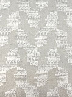 a white and gray pattern on fabric