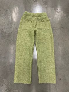 Bluesin's "Fuzzy Grinch" Mohair Flare Cozy Pants  Measures Approximately:  Waist: 32-38 Inches Around (Elastic Waist)  Inseam: 32 Inches  Leg Opening: 10 Inches  Outseam: 45 Inches (Waist To Bottom)  Pants Have Stain But Consider It A Feature Due To Age Of Material As Well As Light Piling  Model 5'11 Wears Size 32  Please Note That Items We're Made From Preloved Materials & Handmade So May Have Slight Discoloring Wear. Clothing To Promote Our Idea Of Sustainability & History  Pieces May Have Sma Fuzzy Flare Pants Outfit, Cozy Winter Bottoms With Pockets, Cozy Long Pants For Winter, Cozy Winter Long Pants, Cozy Straight Leg Winter Bottoms, Cozy Wide Leg Winter Pants, Green Straight Leg Sweatpants For Fall, Green Straight Pants For Winter, Green Winter Long Pants