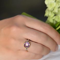 This beautiful stackable bezel set ring features gorgeous faceted natural Purple Amethyst set in 18K Vermeil Gold. There is a row of sparkling faceted white topaz gemstones pave set on the band near the Purple Amethyst Stone. The setting is in sterling silver with gold plating/black rhodium plating.  The ring has a 925 stamp.  Gemstone size is 10 mm.  Also available in sterling silver or rose gold. Please specify your ring size at the checkout. Since I use natural gemstones, the stones may vary slightly in color and shape. Ring will be shipped in Danique Jewelry branded box. Please contact me for any additional info. Thanks! Please visit my full collection of RINGS: http://www.etsy.com/shop/DaniqueJewelry/search?search_query=ring Please visit my full collection of AMETHYST: http://www.etsy Faceted Stackable Rings Fine Jewelry Gift, Faceted Stackable Rings As Fine Jewelry Gift, Elegant Stackable Adjustable Amethyst Ring, Faceted Stackable Rings For Gifts, Fine Jewelry Faceted Stackable Rings For Anniversary, Faceted Stackable Rings For Anniversary, Fine Jewelry Amethyst Faceted Ring, Fine Jewelry Amethyst Rings With Faceted Details, Faceted Amethyst Ring In Fine Jewelry Style