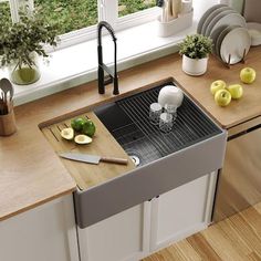 the kitchen sink is clean and ready to be used by someone who has just finished their dishwasher