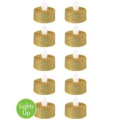 gold glitter candles are arranged in the shape of an upside down candle with white candles