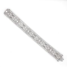 A beautiful Art Deco and retro vintage inspired diamond platinum bracelet. Covered in stunning round cut white natural diamonds 11.29 ct in total. Diamonds get that extra sparkle against the silver brilliance of the platinum 950 metal. Diamonds are all natural in G-H Color Clarity VS. Length: 17.3 cm Width. 1.5 cm Weight: 48.5 g [shortcode] [video] [/video] [/shortcode] Silver Diamond Bracelet With Pavé Setting, White Platinum Diamond Bracelet With Accents, White Platinum Diamond Jubilee Bracelet, White Platinum Jubilee Diamond Bracelet, Platinum Diamond Bracelet With Pave Setting In White Gold, Dazzling White Gold Diamond Bracelet In Platinum, Dazzling Platinum Diamond Bracelet In White Gold, White Gold Platinum Diamond Bracelet For Wedding, Dazzling Silver Diamond Bracelet With Pavé Setting