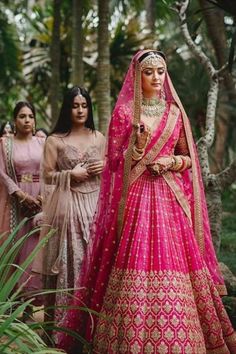 The renaissance of Pink lehengas is a luxe trend that every bride will instantly fall in love with. Take inspiration from these gorgeous brides! :heart: #weddingoutfits #weddinglehenga #weddingfashion #bridaloutfits Magenta Wedding Lehenga, Lahga Design Bridal Lehenga, Hot Pink Lengha Bridal, Bridal Lehenga Unique Colour, Wedding Ghagra Brides, Magenta Lehenga Bridal, Pink Bridal Lehenga Brides, Hot Pink Bridal Lehenga Wedding