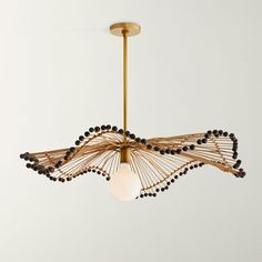 a light fixture with beads hanging from it