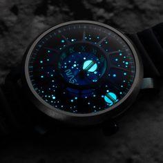 All Trappist-1 NASA Edition models have back-filled luminous hands and silkscreened dials for stargazing. The Orbiting Planetary System consists of glowing Super-LumiNova indices and planets to help space explorers keep track of time as they travel in the darkest regions of the universe. The inner luminous planet represents the hours while the outer luminous planet shows the minutes, all while orbiting around the central axis. The Trappist-1 Automatic model also features tritium tubes! You'll al Concept Watch, Tritium Watches, Dark Void, Space Watch, Clock Work, Unusual Watches, Planetary System, Neutron Star, Star Watch