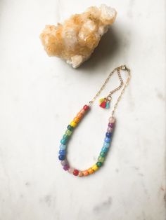 "ABOUT THIS PIECE:  A cheerful, limited edition necklace. Materials include: glass, semi-precious stone, cotton tassels, 14k gokd vermeil paperclip chain. 16\" long with 2\" extender. Vermeil hardware. Vermeil is a tarnish resistant material that has a 925 sterling silver base metal and is coated in 2.5 micron thickness of 14k gold.  Note: also available in choker length if that is your preference. To measure your next size, take a string and wrap it around your neck, then measure the length of Bracelet Inspo, Rainbow Necklace, Eco Friendly Jewelry, Colorful Jewelry, Necklace Unique, Unique Necklace, Necklace And Bracelet, Trombone, Sustainable Jewelry