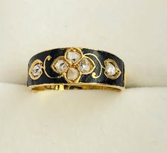 A delightful Victorian mourning, memorial ring. Full of white sparkly rose cut diamonds. It is dated 1882 and at that period South African diamond mines were developed and quality really picked up . The diamonds sparkle brightly amid the black enamel and the rich 18ct Gold.  The ring is marked for 18ct gold , jewellers initials FWP, possibly Frederick William Powell. Also in memory of Dear Father , J Baxter. It is size M and not really sizeable - see photos.  Height 6.5mm, 0.27 inch  Weight 3.18 gms Jewelry Smithing, William Powell, Memorial Ring, Diamond Mines, Peridot Ring, Gems Jewelry, Antique Jewellery, Rose Cut Diamond, Black Enamel