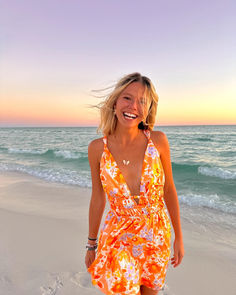 Our best selling Genovia dress now comes in a stunning orange floral print! This gorgeous mini dress looks best paired with heels and a shoulder bag to bring the WOW factor at your next cocktail event. Flirty Orange Floral Print Dress, Flirty Orange Beach Dress, Orange Floral Print Mini Dress For Vacation, Orange Floral Print Beach Dress, Orange Floral Print Dress For Beach Season, Orange Summer Dresses For Holiday, Famous Dress, Orange Floral Print, Dress Looks