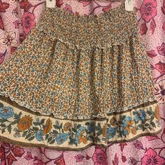 Adorable Spell And Gypsy Like Boho Smocked Mini Skirt Very Boho But Not Too Short ! I’m 5’3 And It’s Just At My Knee Also Very Stretchy And Would Work For Xs-M Bohemian Mini Skirt For Day Out, Bohemian Cotton Mini Skirt For Day Out, Hippie Cotton Mini Skirt For Spring, Casual Boho Print Skirt For Summer, Bohemian Skirt With Smocked Back, Bohemian Mini Length Bottoms With Floral Print, Bohemian Floral Print Mini Skirt For The Beach, Casual Boho Print Maxi Skirt, Spring Bohemian Stretch Mini Skirt