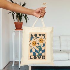 This 100% cotton bag comes in one size - 15" x 16"- perfect for everyday wear. While the canvas material will show off your designs in great colors, it's durable and will last for years. The bag features 20" handles (made from the same canvas), making it easy to carry even with a week's worth of shopping. .: 100% cotton canvas .: Heavy fabric (12 oz/yd² (406.9 g/m .: Sewn-in label .: Available in natural and black colors Canvas Making, Love Canvas, Canvas Tote Bag, Cotton Bag, Sew-in Labels, Heavy Fabric, Canvas Material, Canvas Tote, Cotton Canvas