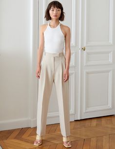 Bestseller -PREORDER Estimated arrival January 7 Chic sand colored high waist pleated trousers . Brand Pixie Market 80% polyester , 16% rayon , 4% elastaneDry clean only Side pockets Faux back vent pockets High waist Size xs waist 24.5" , hips 34.5"Size small waist 26.5", hip 36.5"Size medium waist 28.5", hip 38.5"Size large waist 30.5", hip 40.5"Inseam 27" Total length 39"Model is wearing an xs and model's height is 5.8"Vintage style Pleated Pants Outfit, Pixie Market, Horse Inspiration, Trouser Outfit, January 7, Pleated Trousers, Trouser Pants Women, Pleated Pants, White Horse