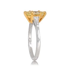 This ring features a GIA-certified 1.01 carat marquise-cut Fancy Yellow diamond set in prongs. This ring is 18k yellow gold on platinum. The shoulders are set with tapered baguette diamonds, the combined weight of which is 0.20 carats.
The measurements of the center stone are approximately 11.75mm x 4.80mm.
This ring can be resized to any finger size at no extra cost.
If you have any questions about the Alameda ring, please feel free to contact us. Gia Certified Marquise Diamond Ring Fine Jewelry, Gia Certified Platinum Marquise Rings, Gia Certified Marquise Platinum Rings, Gia Certified Marquise Diamond Ring For Anniversary, Gia Certified Marquise Cut Luxury Diamond Ring, Gia Certified Luxury Marquise Cut Diamond Ring, Luxury Marquise Cut Gia Certified Diamond Ring, Gia Certified Marquise Cut Yellow Gold Wedding Ring, Gia Certified Yellow Gold Marquise Cut Wedding Ring