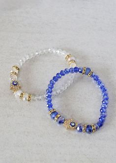 two bracelets with blue beads and gold accents