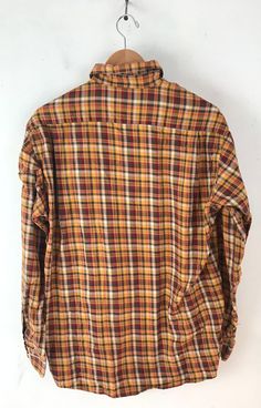 "-Description- >men orange, yellow, green, red plaid shirt >button front >collared >open pocket on the front >size medium >perfect plaid for the fall/autumn! >condition: great >color(s): orange, yellow, green, red, white >fabric(s): cotton >brand: john ashford >care: machine wash -Measurements- >size: medium ✩ all measurements are taken with the item laying flat & some sizes are estimates so please check measurements ✩ chest:44\" / 112cm length: 30\" / 76c Plaid Collared Shirt With Placket, Collared Plaid Shirt With Placket, Plaid Collared Shirt, Fall Multicolor Collared Shirt, Classic Orange Shirt For Fall, Multicolor Button-up Flannel Shirt For Fall, Classic Multicolor Shirt For Fall, Classic Multicolor Fall Shirt, Yellow Shirt With Button Closure For Fall