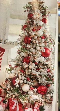 a christmas tree decorated with red and white ornaments