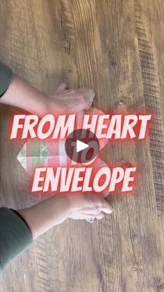 someone is holding their hands up with the words from heart to envelope on it