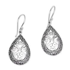 Dewa Arimbawa handcrafts these teardrop sterling silver dangle earrings. Scrolling motifs abound in this elegant design with a border of Balinese tendrils and scrolled openwork in the center. Ornate Sterling Silver Teardrop Earrings For Gift, Ornate Sterling Silver Teardrop Earrings As Gift, Traditional Sterling Silver Teardrop Earrings As Gift, Sterling Silver Teardrop Earrings With Intricate Design, Sterling Silver Intricate Teardrop Earrings, Ornate Sterling Silver Teardrop Filigree Earrings, Traditional Nickel-free Sterling Silver Teardrop Earrings, Traditional Silver Teardrop Earrings With Intricate Design, Silver Traditional Teardrop Earrings With Intricate Design