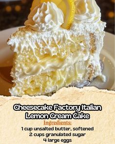 there is a piece of cake with whipped cream and lemon on top, sitting on a plate