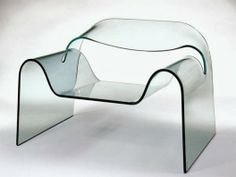 a glass table that is shaped like a wave