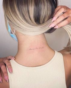 a woman's back neck with the words, don't be afraid on it