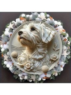 a white dog is sitting in the center of a wreath with flowers and leaves on it