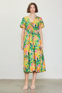 A color palette of mood-boosting brights enlivens this floral-printed midi dress. Framed by voluminous bubble sleeves, it's got a V-shaped neckline with tie detailing that lets you adjust the fit of the bodice. •V-shaped neckline •Adjustable tie detailing •Short bubble sleeves •Elasticized back waist •Mid-length hem Item Number: 99794 Vacation Dresses Casual, Wedding Guest Dress Trends, Casual Wedding Dress, Floral Print Midi Dress, Print Midi Dress, Vacation Dresses, Sweater Sale, Printed Midi Dress, A Color