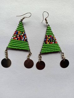 Handmade Beaded Earrings - Colorful, Lightweight, and Stylish! ✨ 🌿 Features: **Handcrafted: Each pair is meticulously made using high-quality seed beads. **Boho-Inspired Design: Ideal for those who adore bohemian, festival, or earthy styles. **Lightweight & Comfortable: Perfect for everyday wear or special occasions without causing discomfort. **Vibrant Colors: Choose from a variety of colors to match any wardrobe. **Perfect Gift: Great for birthdays, anniversaries, or as a thoughtful gift for Beaded Chain Earrings As Gift, Beaded Chain Earrings With Round Beads For Gifts, Green Dangling Beads Earrings For Festivals, Traditional Polished Beaded Earrings For Gifts, Handmade Round Beaded Earrings For Festivals, Green Polished Bead Earrings, Festive Green Beaded Earrings, Green Earrings With Polished Round Beads, Polished Bead Earrings For Festivals And Gifts