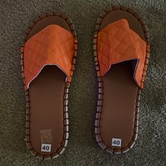 Beautiful Orange Slides Never Worn Orange Slide Sandals For Spring, Orange Flat Slippers For Summer, Orange Flat Synthetic Slippers, Orange Flat Sandals For Spring, Orange Slip-on Summer Slippers, Orange Slip-on Slippers For Summer, Summer Flat Orange Slippers, Comfortable Orange Summer Slippers, Casual Orange Closed Toe Sandals