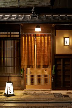 a lantern is lit up in front of an old building