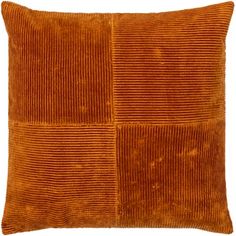 an orange velvet pillow with four squares on the front and sides, all in different colors