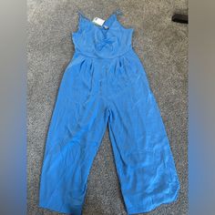 Blue Jumpsuit New With Tags. Has A Belt That Can Be Worn Or Not. From H&M Size M. Perfect For A Wedding, Night Out Ect Light Blue V-neck Jumpsuit For Party, Blue Jumpsuits And Rompers For Summer Workwear, Blue Jumpsuits And Rompers For Work In Summer, Light Blue Jumpsuits And Rompers For Spring Party, Light Blue Jumpsuits And Rompers For Spring Workwear, Chic Blue Jumpsuits And Rompers For Spring, Black Sleeveless Jumpsuit, Chambray Jumpsuit, Jumpsuit Navy Blue