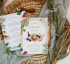 the wedding stationery is laid out on a wicker basket