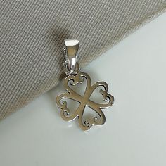 ▪︎ ONE sterling silver four leaf clover pendant/charm. ▪︎ Size: 10 mm x 12 mm Jump ring:2mm WEight: 0.47 gm ▪︎ This multi purpose pendant can be used as a charm in necklaces, bracelets, key chains, zip pullers etc. Most of my pieces are marked with a 925 silver stamp. ▪︎ Please note: This listing is for ONE pendant and comes WITHOUT the chain, however, you can add a snake chain in the required length while making your selection. You can also opt to choose other kinds of neck chains or bracelet c Sterling Silver Flower Charm Gift, Elegant Sterling Silver Pendant Charms, Silver Hypoallergenic Jewelry For Good Luck, Hypoallergenic Silver Good Luck Jewelry, Silver Pendant Charms Stamped 925, Handmade Sterling Silver Charms In Silver, Sterling Silver Pendant Charm In Silver, Silver Pendant Charms For Anniversary, Silver Sterling Silver Pendant Charm