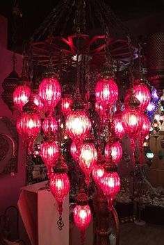 a chandelier with many red lights hanging from it