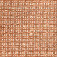 an orange and white rug with small squares on the top, in various sizes and colors