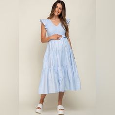 A Solid Hue Maternity Midi Dress. Features A V-Neck, Smocked Bodice, Flutter Cap Sleeves, A Ruffle Waist Accent, Side Pockets, And A Tiered Skirt. Skirt Is Partially Lined. 100% Cotton &Merci By Pinkblush New Without Tags Small Inventory #P5162 Large Inventory #P6226 Spring V-neck Smocked Dress For Daywear, Maternity V-neck Ruched Dress, Maternity V-neck Dress With Ruched Details, V-neck Ruched Maternity Dress, Summer Maternity Midi Dress With Smocked Back, Spring V-neck Midi Dress With Smocked Back, V-neck Midi Dress With Smocked Back For Spring, V-neck Smocked Midi Dress For Vacation, V-neck Smock Midi Dress For Vacation